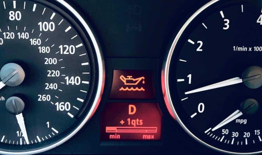 oil warning indicator light on car dashboard
