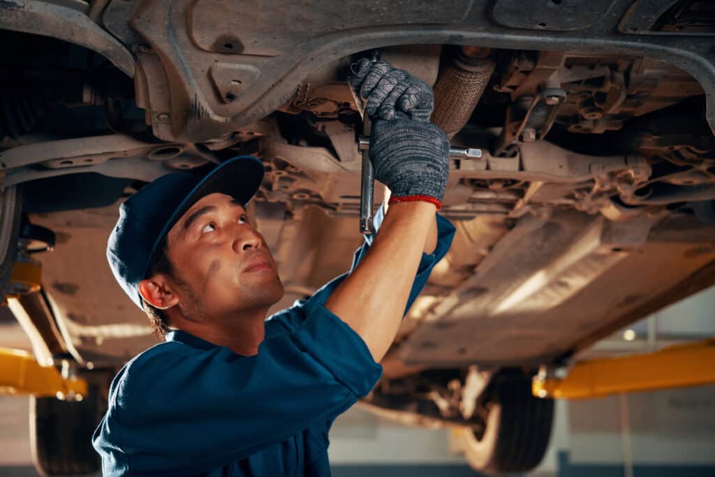 Mechanic repairing a car in a garage