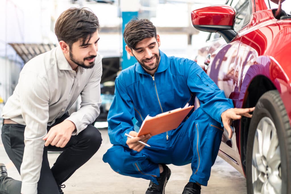 customer checking auto body repair