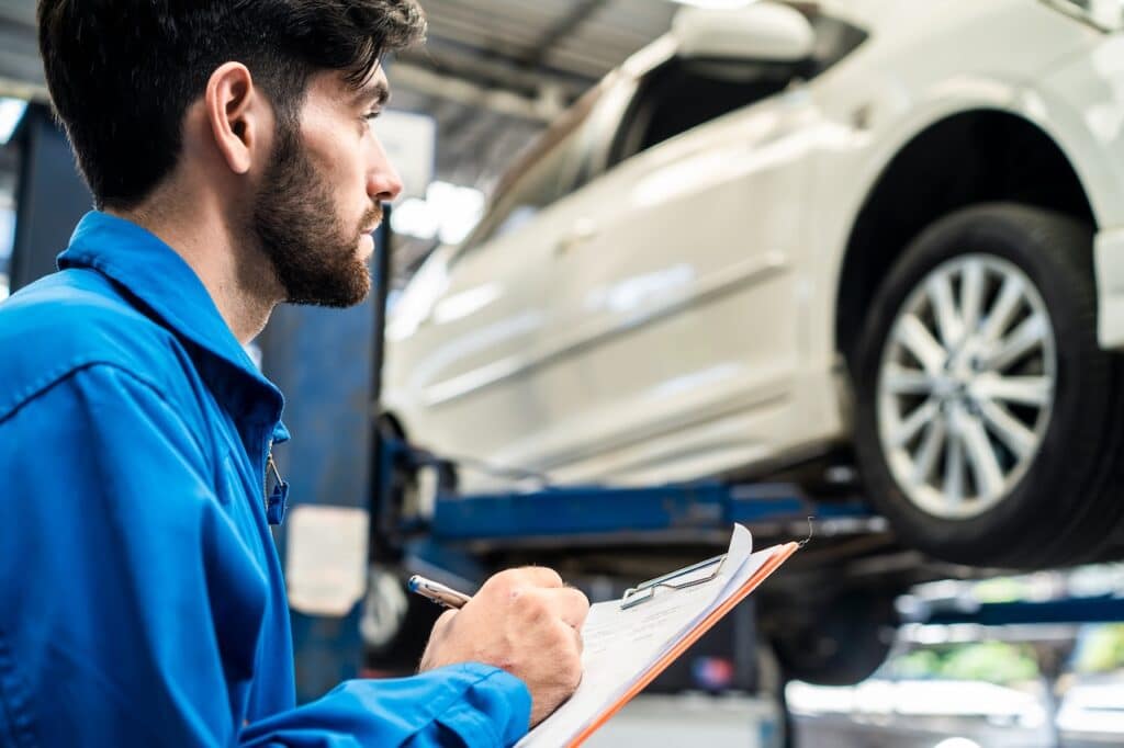 technician working on auto body shop repair